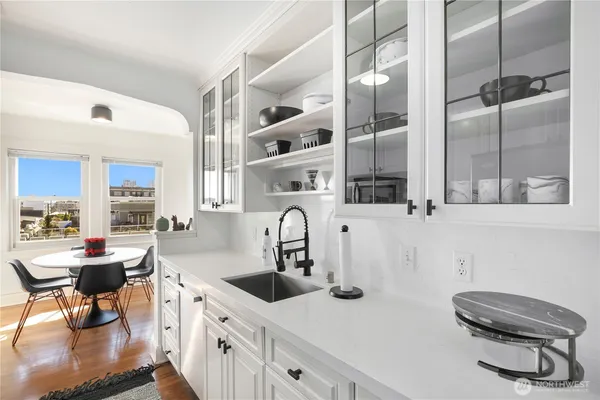 a kitchen with a sink cabinets and window