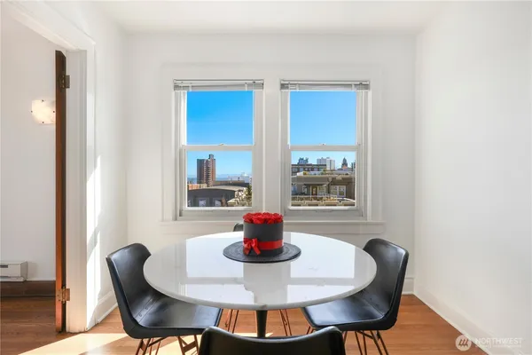 a dining room with table and chairs
