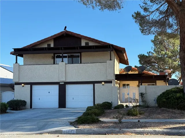a front view of a house with garage