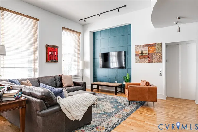 a living room with furniture and a flat screen tv