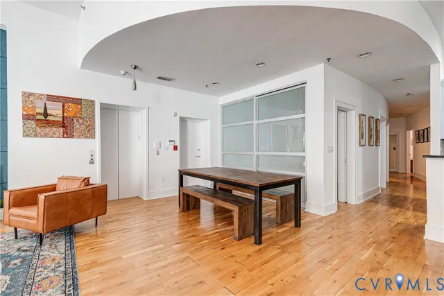 a room with furniture a rug and a window