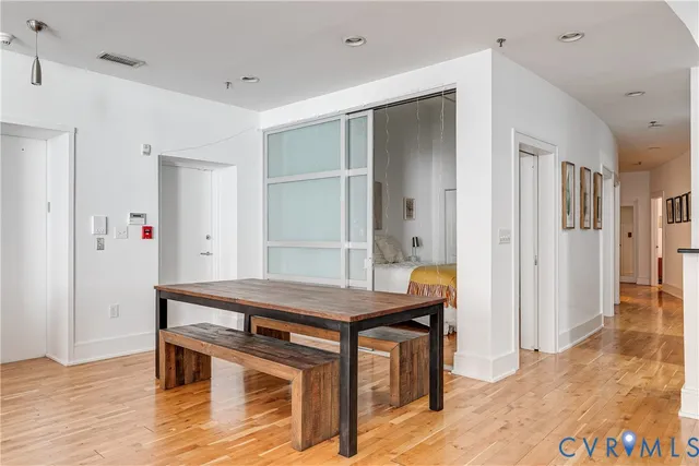 a view of a hallway and wooden floor