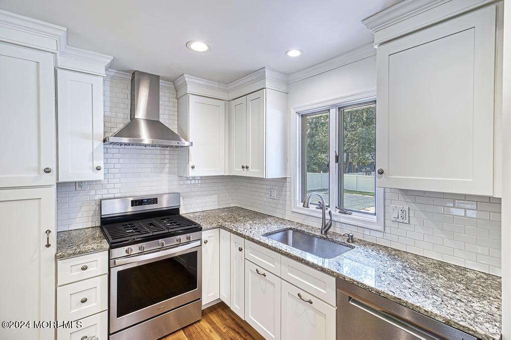 120 Frede Drive Brick, NJ 08724 - Photo 11 of 55 a kitchen with granite countertop a sink stainless steel appliances and cabinets