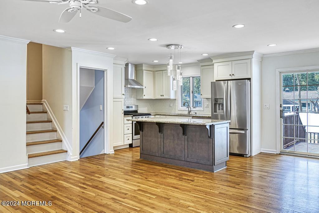 120 Frede Drive Brick, NJ 08724 - Photo 14 of 55 a kitchen with stainless steel appliances granite countertop a refrigerator and a stove top oven