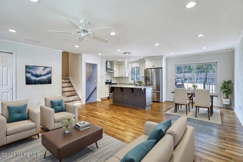 120 Frede Drive Brick, NJ 08724 - Photo 15 of 55 a living room with furniture kitchen view and a wooden floor