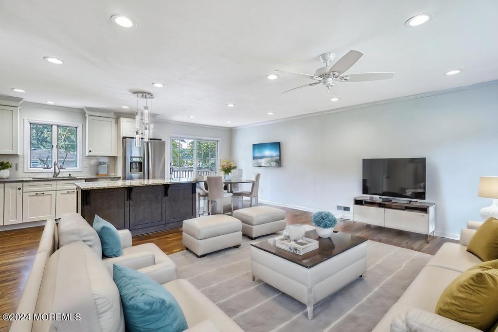 120 Frede Drive Brick, NJ 08724 - Photo 16 of 55 a living room with furniture kitchen view and a flat screen tv