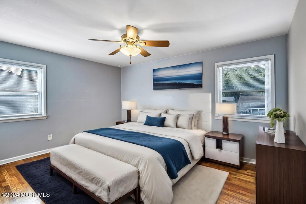 120 Frede Drive Brick, NJ 08724 - Photo 17 of 55 a bedroom with a bed a couch and a flat screen tv