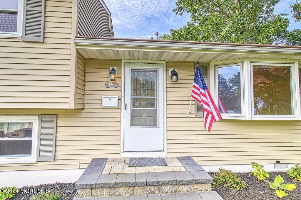 120 Frede Drive Brick, NJ 08724 - Photo 2 of 55 a view of a house with a potted plant and a window
