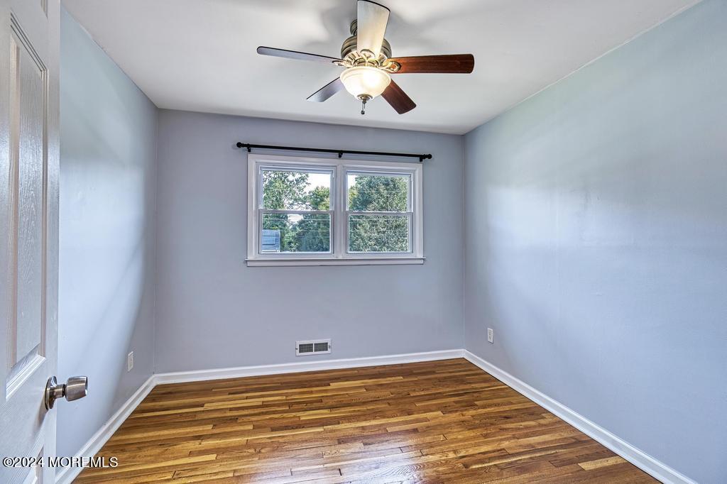 120 Frede Drive Brick, NJ 08724 - Photo 21 of 55 a view of empty room with window and ceiling fan