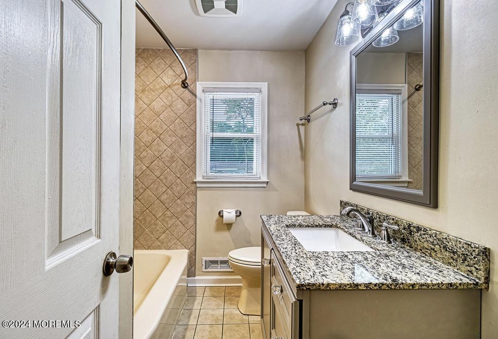 120 Frede Drive Brick, NJ 08724 - Photo 32 of 55 a bathroom with a granite countertop sink a mirror and shower