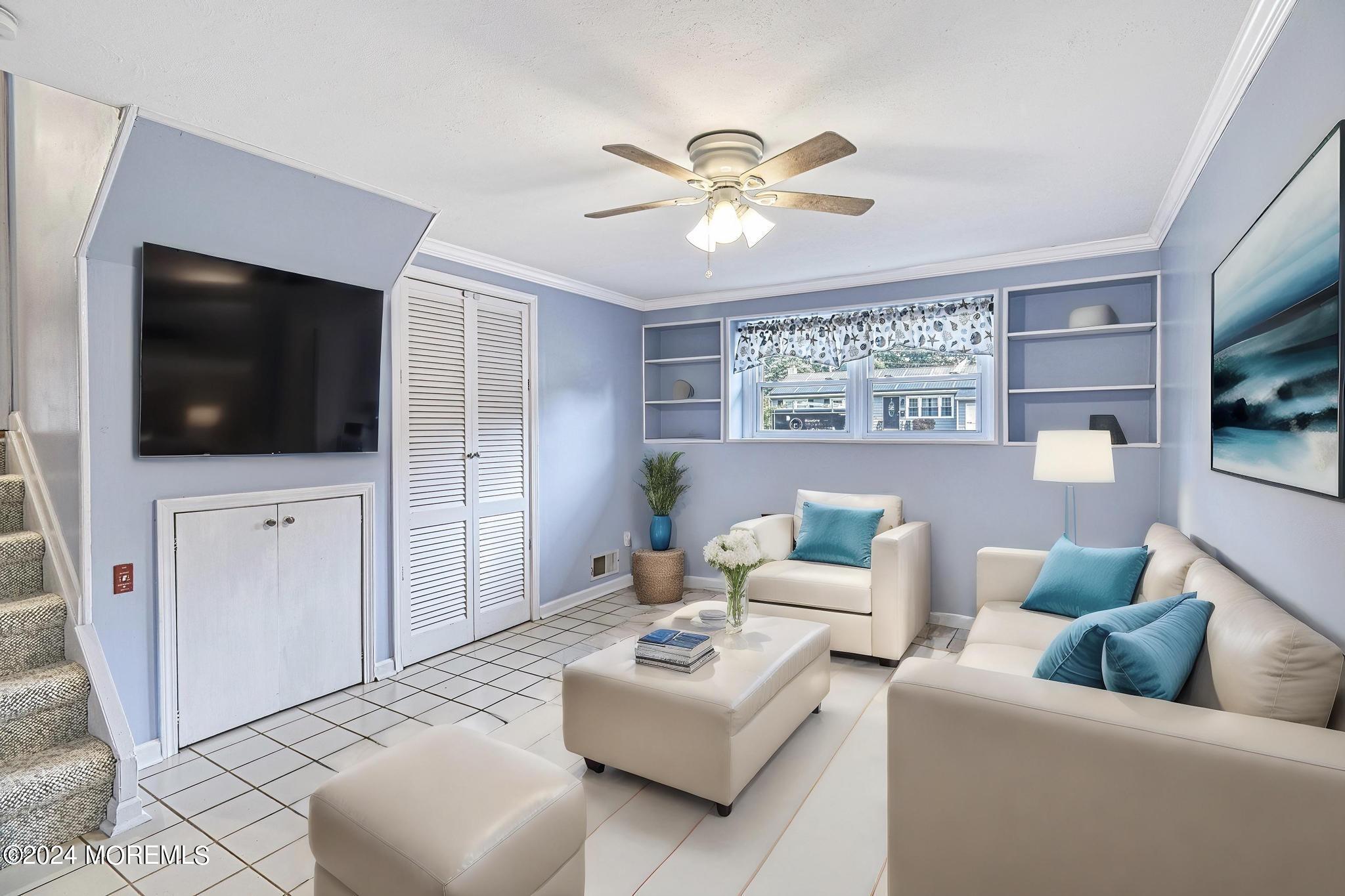 120 Frede Drive Brick, NJ 08724 - Photo 36 of 55 a living room with furniture and a flat screen tv