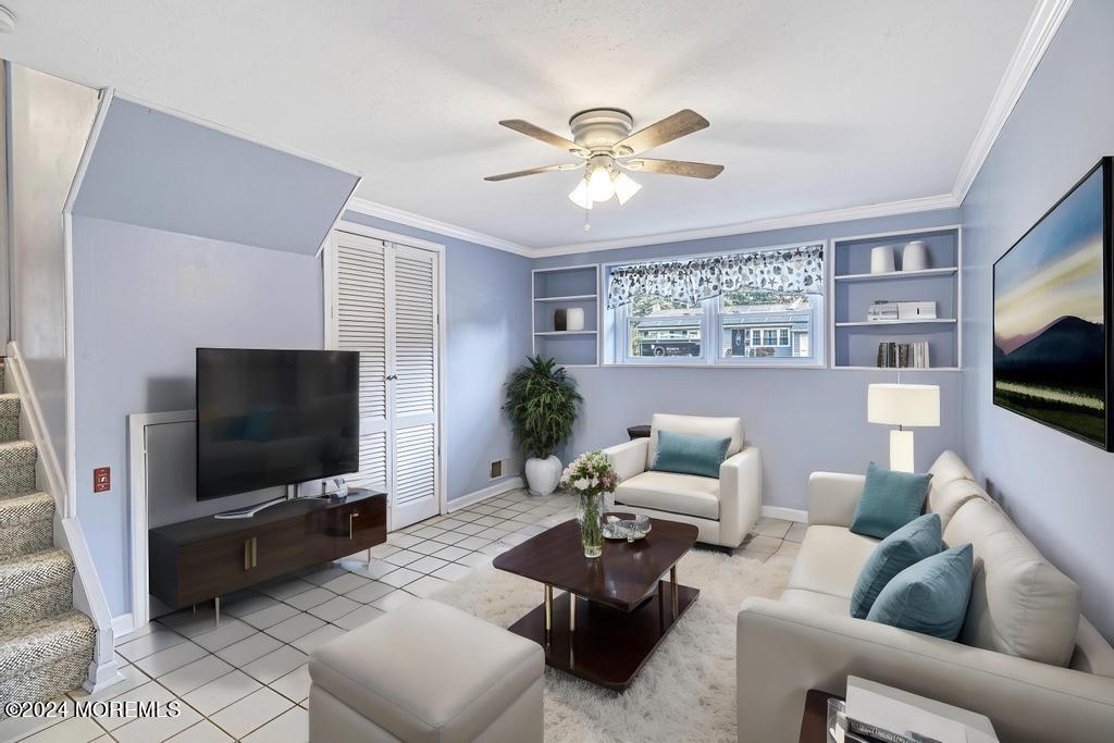 120 Frede Drive Brick, NJ 08724 - Photo 38 of 55 a living room with furniture and a flat screen tv