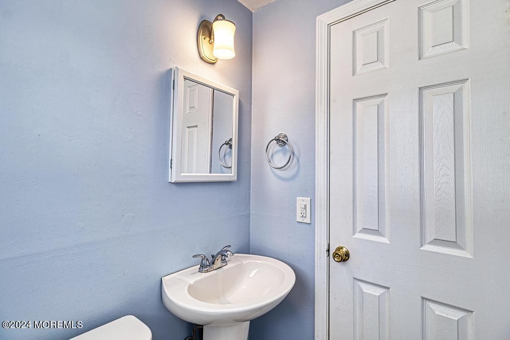 120 Frede Drive Brick, NJ 08724 - Photo 42 of 55 a bathroom with a sink and a mirror