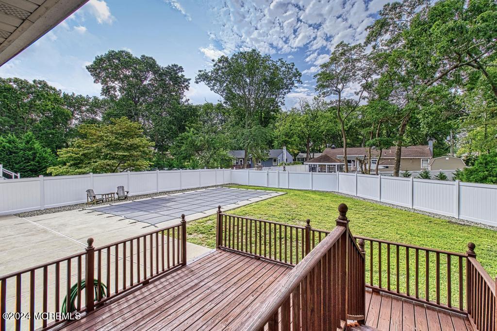 120 Frede Drive Brick, NJ 08724 - Photo 46 of 55 a view of a balcony with wooden floor and seating space