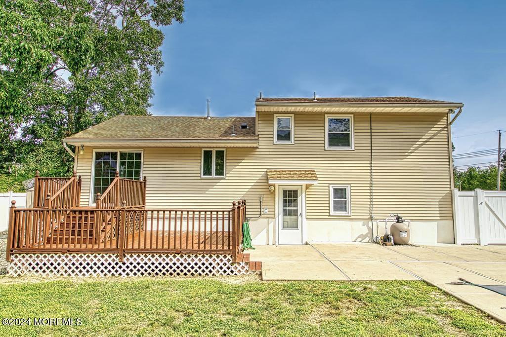 120 Frede Drive Brick, NJ 08724 - Photo 49 of 55 a view of a house with a small yard and wooden fence