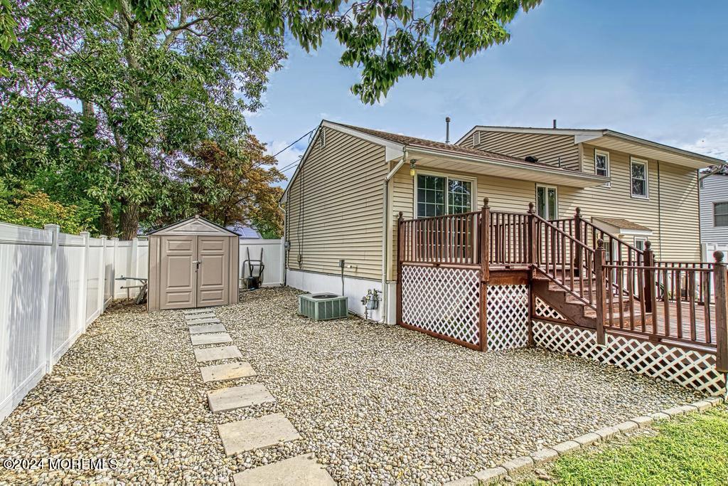 120 Frede Drive Brick, NJ 08724 - Photo 50 of 55 a backyard of a house with a deck