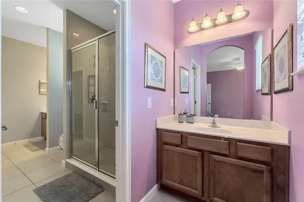 a bathroom with a sink vanity and a mirror
