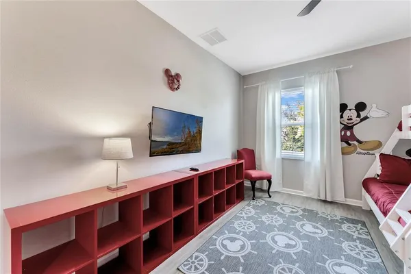 a room with furniture and a flat screen tv