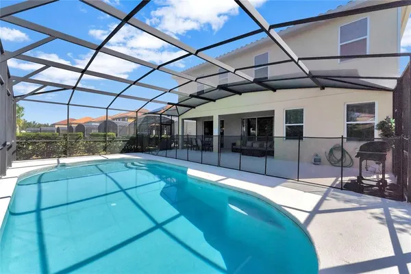a view of a swimming pool with a patio