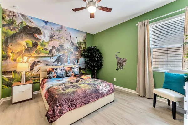 a bedroom with a bed and a chair
