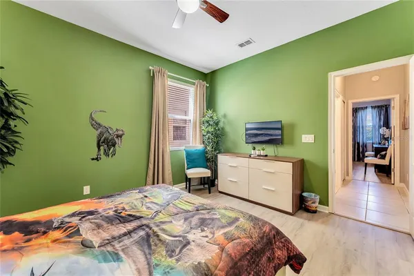 a bedroom with a bed and a dresser