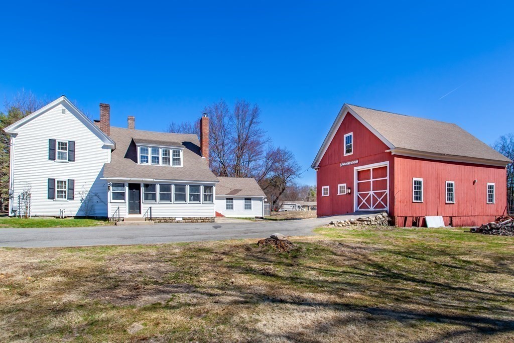 108 River Road Pepperell, MA 01463 - Photo 3 of 24 a front view of a house with a yard
