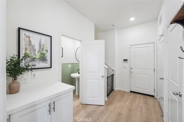 a view of kitchen with furniture and wooden floor