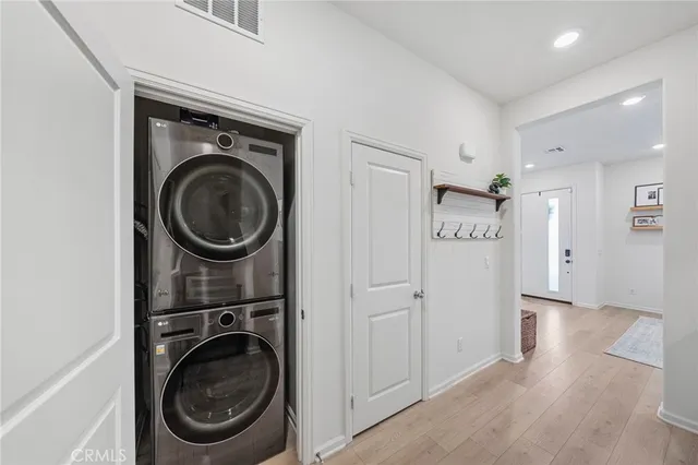 a view of a hallway with washer and dryer