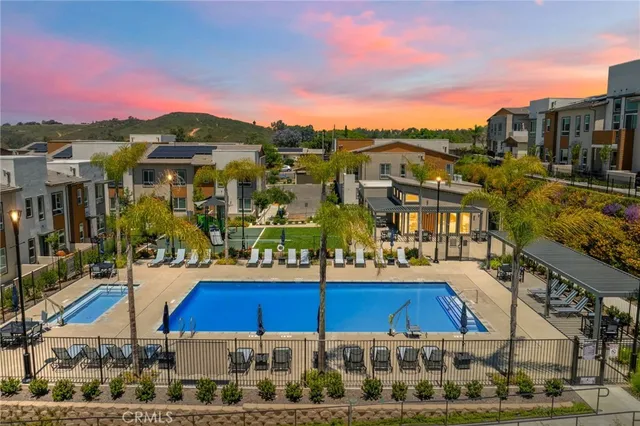 a view of multiple houses with a street