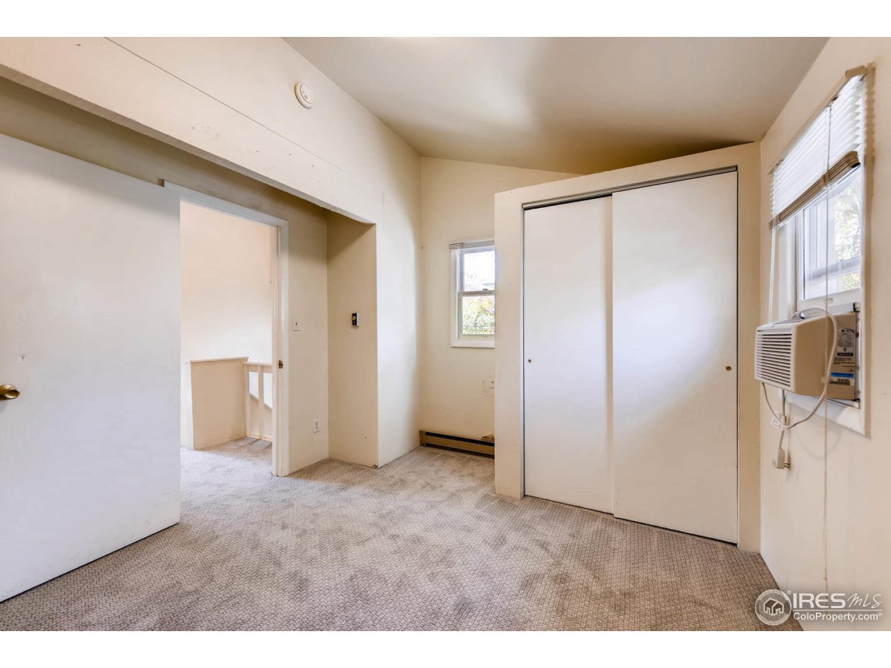 1623 18th Street Boulder, CO 80302 - Photo 11 of 11 a view of a big room with wooden floor and windows