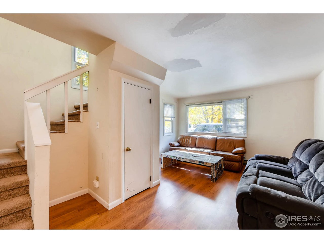 1623 18th Street Boulder, CO 80302 - Photo 2 of 11 a living room with furniture and a large window