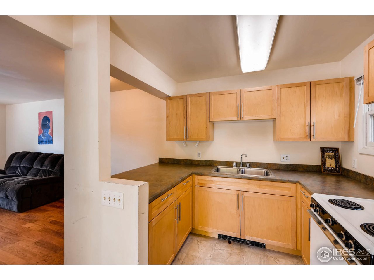 1623 18th Street Boulder, CO 80302 - Photo 3 of 11 a kitchen with a sink stove and cabinets