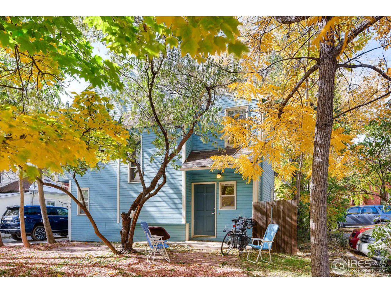 1623 18th Street Boulder, CO 80302 - Photo 5 of 11 a view of a house with a tree in the background