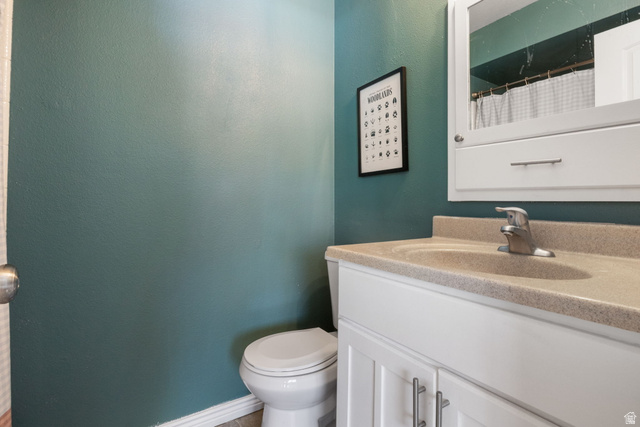 41 Benchmark Village Tooele, UT 84074 - Photo 16 of 26 Full bath featuring vanity and a shower with shower curtain