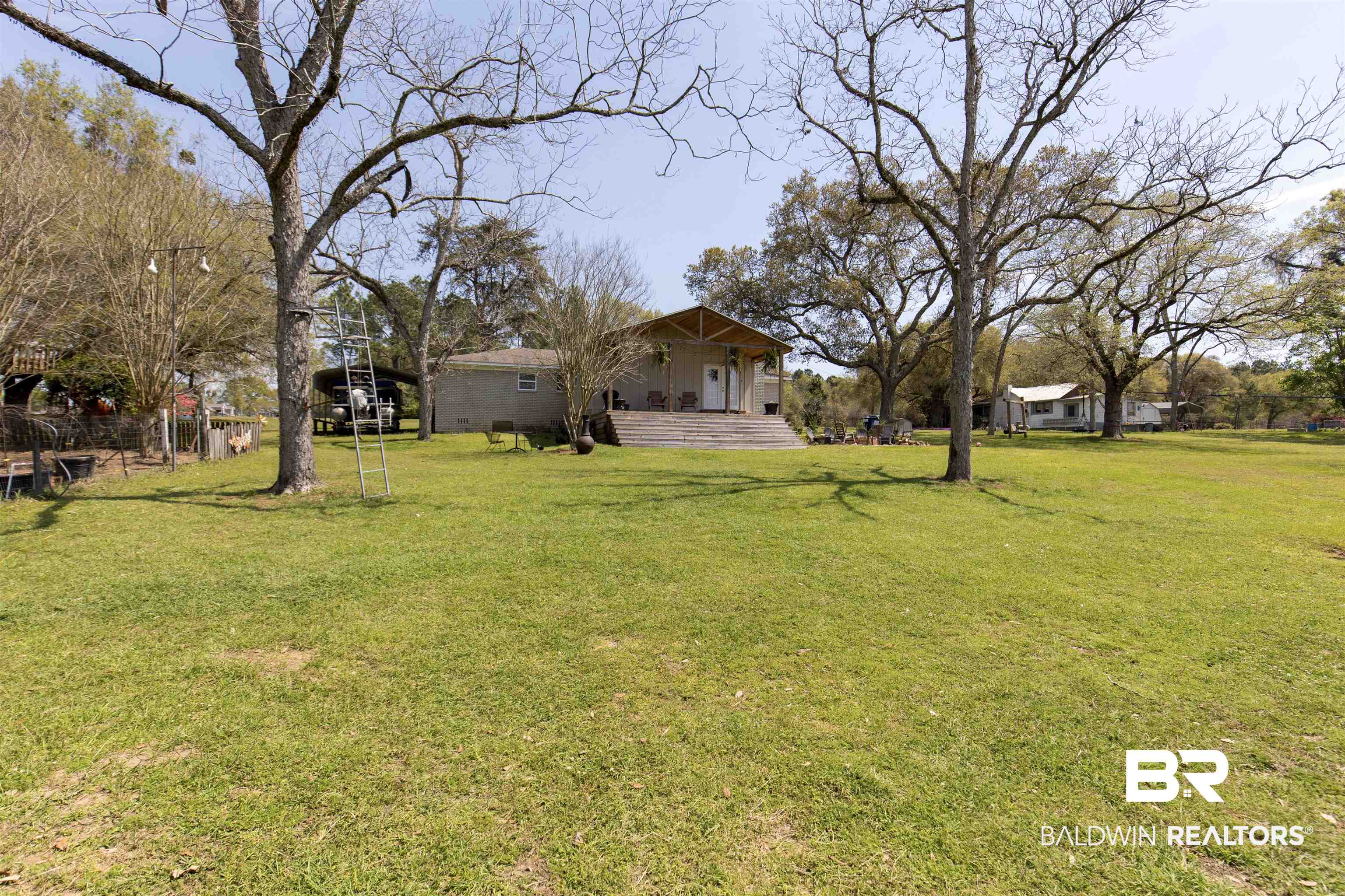 11100 Rhett McConnell Road Theodore, AL 36582 - Photo 23 of 47 View of green lawn