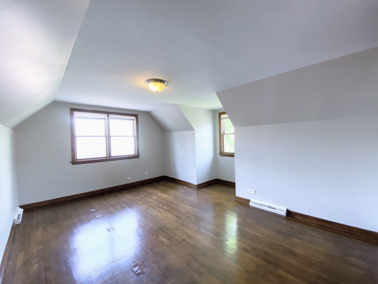 3003 Longfellow Avenue Hazel Crest, IL 60429 - Photo 14 of 19 an empty room with wooden floor and windows