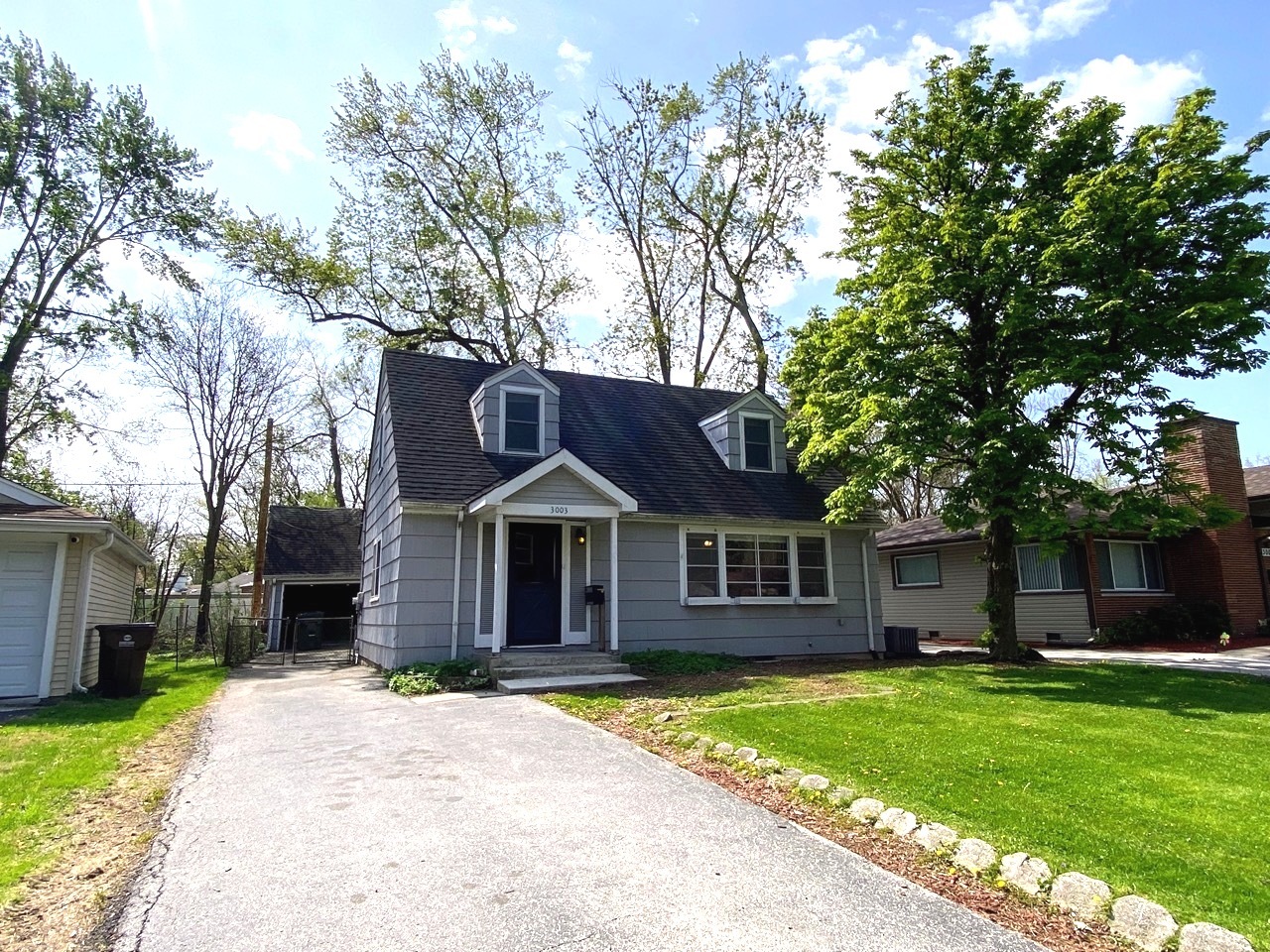 3003 Longfellow Avenue Hazel Crest, IL 60429 - Photo 2 of 19 a front view of a house with a garden