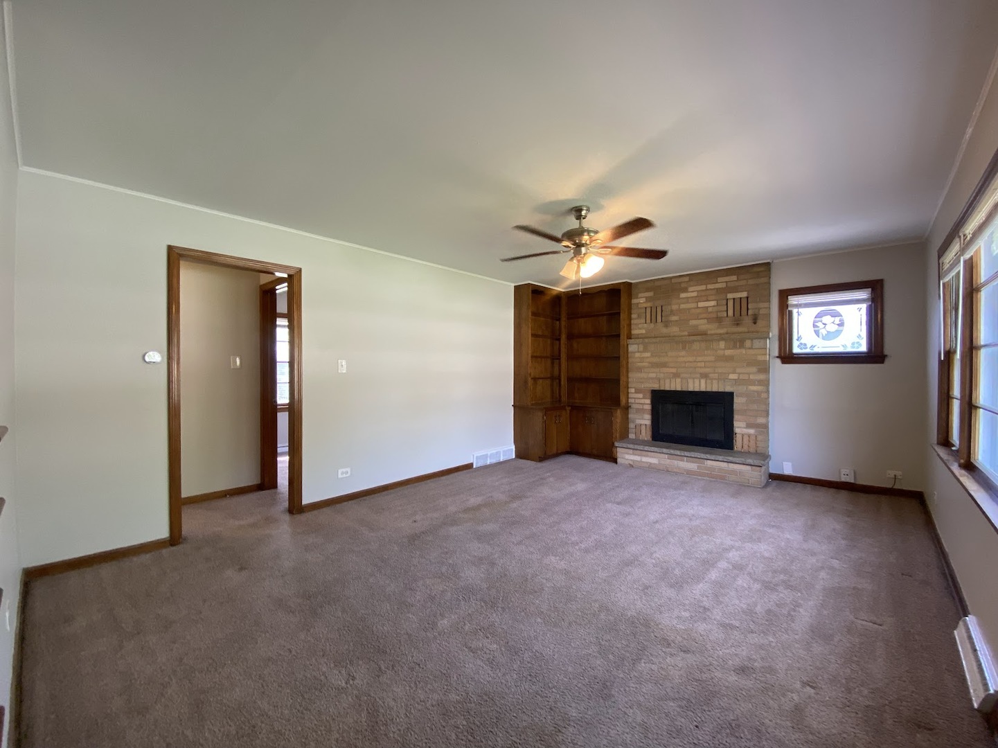 3003 Longfellow Avenue Hazel Crest, IL 60429 - Photo 6 of 19 an empty room with windows and fireplace