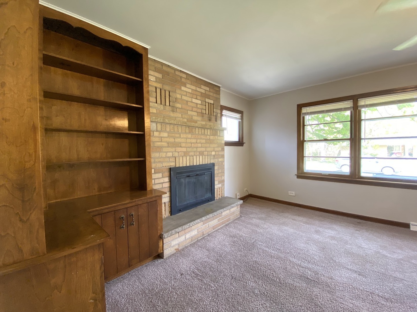 3003 Longfellow Avenue Hazel Crest, IL 60429 - Photo 7 of 19 a view of an empty room with a fireplace and a window