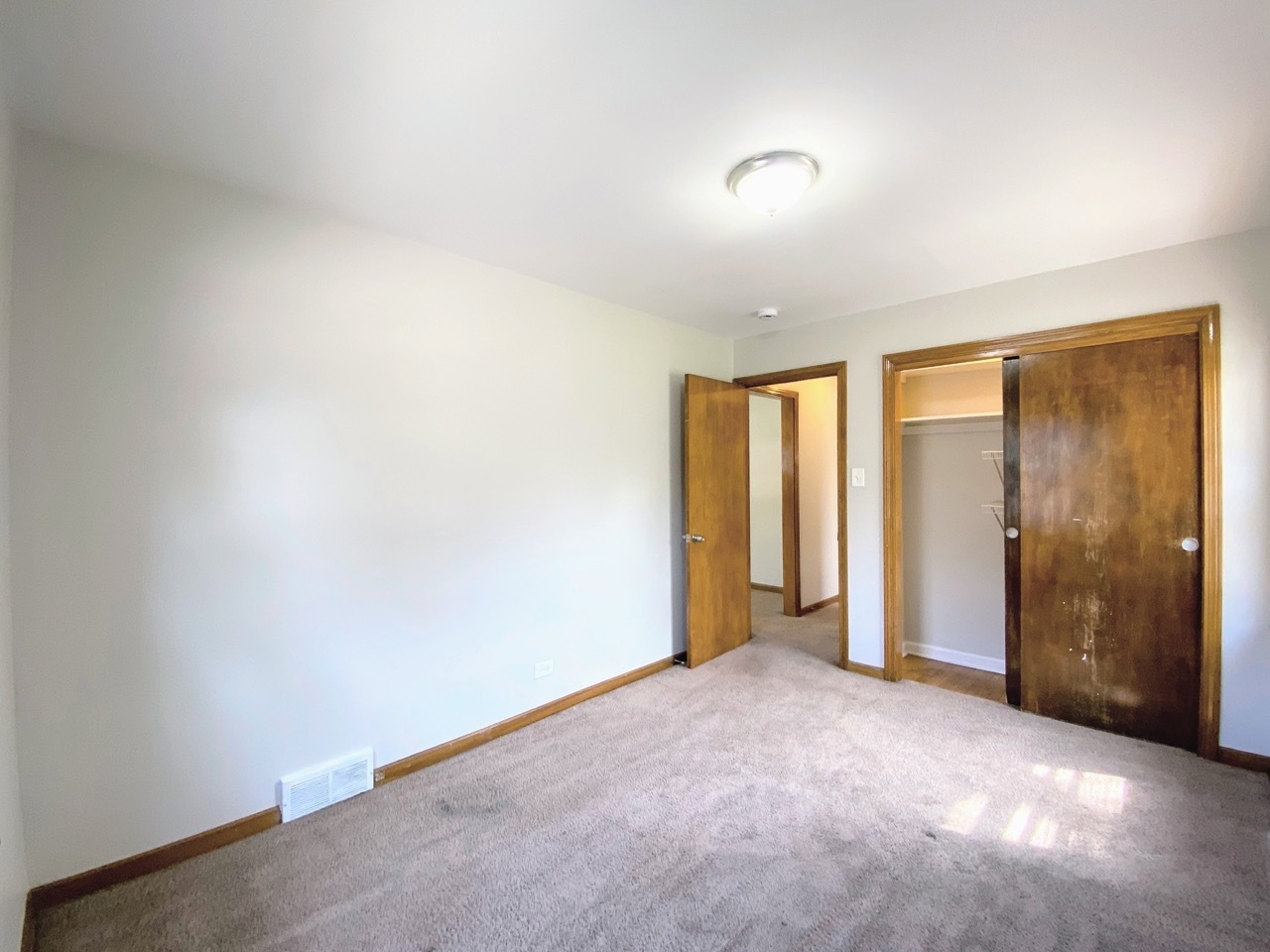 3003 Longfellow Avenue Hazel Crest, IL 60429 - Photo 9 of 19 wooden floor in an empty room with a window