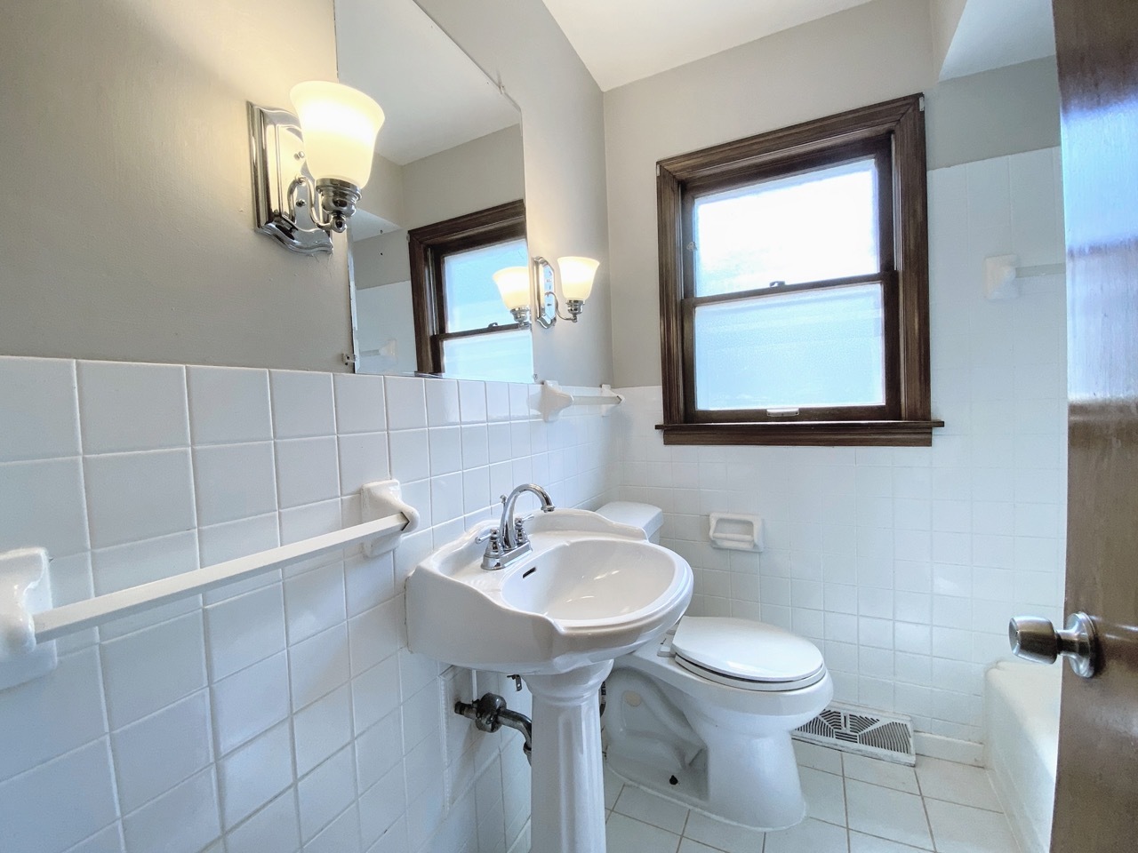 3003 Longfellow Avenue Hazel Crest, IL 60429 - Photo 10 of 19 a bathroom with a sink a toilet and mirror
