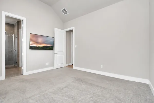 an empty room with a door and a window