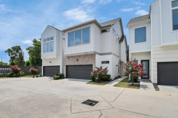 a building with potted plants in front of it