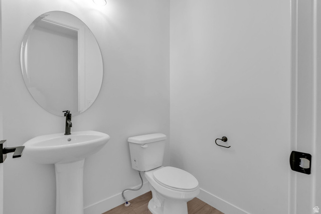 2821 Scarlet Road, Unit 149 Eagle Mountain, UT 84005 - Photo 12 of 28 Powder bathroom on main floor with matte black fixtures.