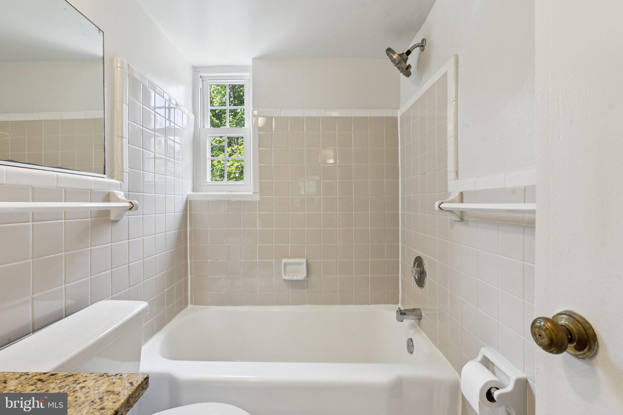 2107 North Scott Street, Unit 70 Arlington, VA 22209 - Photo 16 of 19 a bathroom with a bathtub and a shower