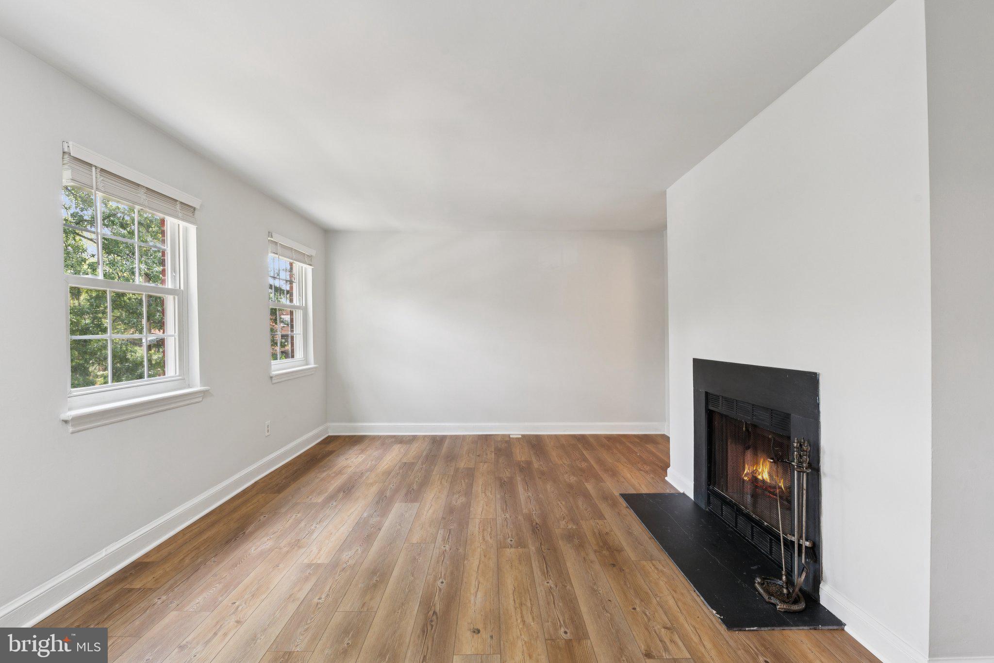 2107 North Scott Street, Unit 70 Arlington, VA 22209 - Photo 2 of 19 wooden floor in an empty room with a window