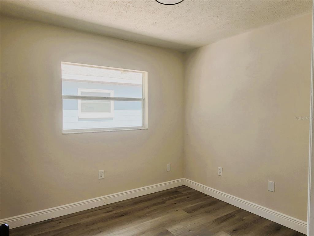 614 Huntington Street Brandon, FL 33511 - Photo 12 of 16 a view of a small space with wooden floor a sink and a window