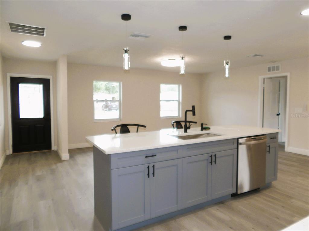 614 Huntington Street Brandon, FL 33511 - Photo 7 of 16 a bathroom with a sink vanity granite tub and a mirror