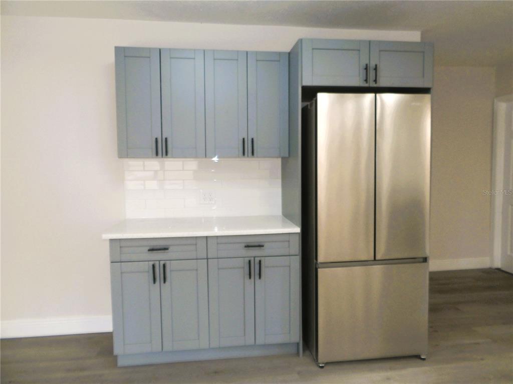 614 Huntington Street Brandon, FL 33511 - Photo 8 of 16 a kitchen with cabinets and stainless steel appliances