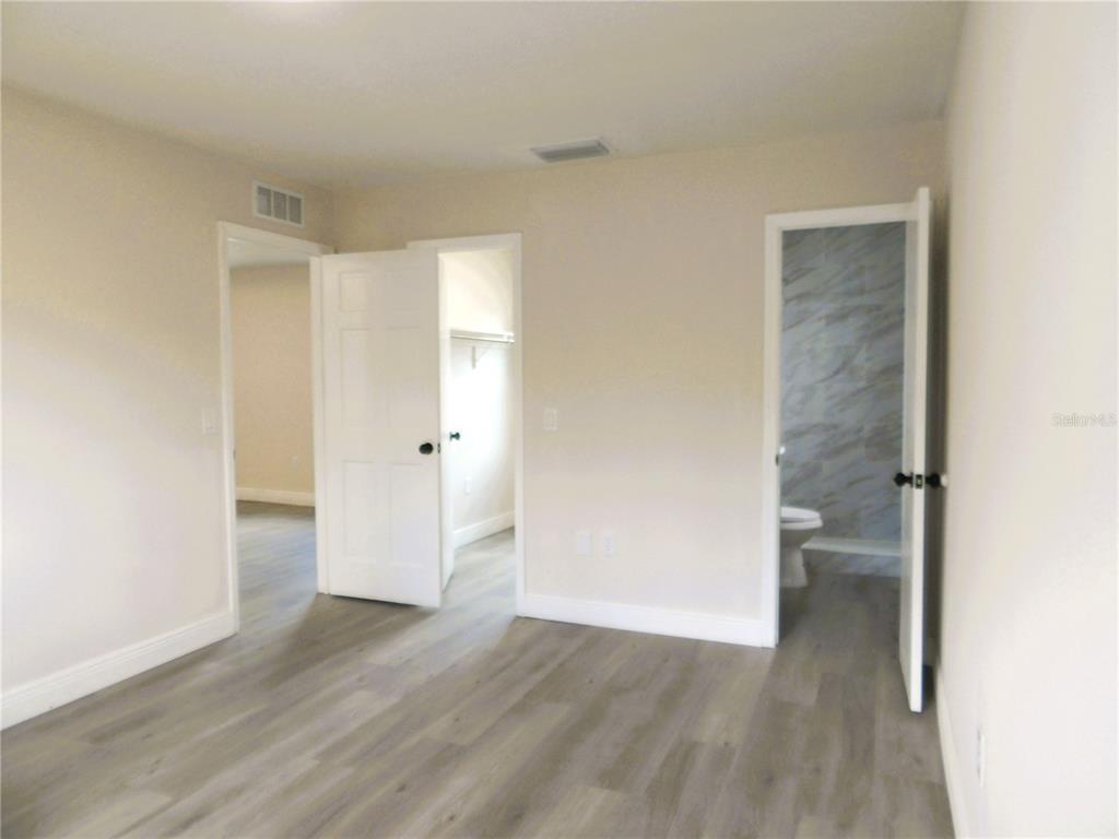 614 Huntington Street Brandon, FL 33511 - Photo 10 of 16 a view of empty room with wooden floor